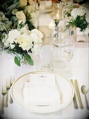 White rose and cream vintage-inspired wedding reception decor