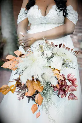 A burgundy and rust-toned wedding bouquet