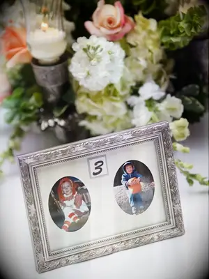 framed childhood photos as wedding table numbers