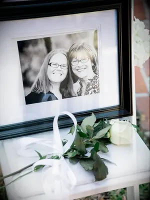 picture of deceased loved one with white rose
