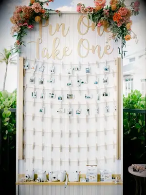 polaroid picture display at beach wedding