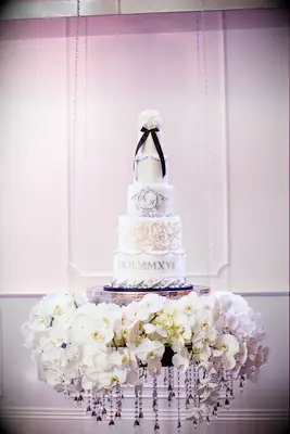 Five-tier wedding cake with roman numerals