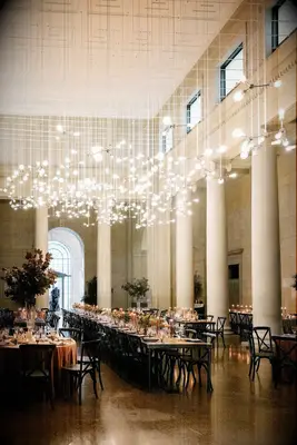 modern wedding reception venue space with lightbulbs hanging from long strings