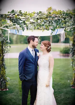 Eucalyptus and vine adorned chuppah at Jewish wedding