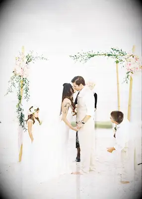 Eucalyptus and vine adorned chuppah at Jewish wedding