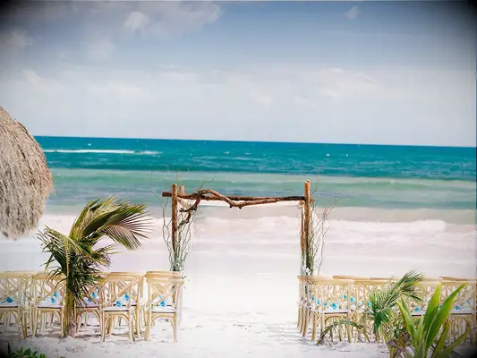 Natural driftwood chuppah at beach wedding 