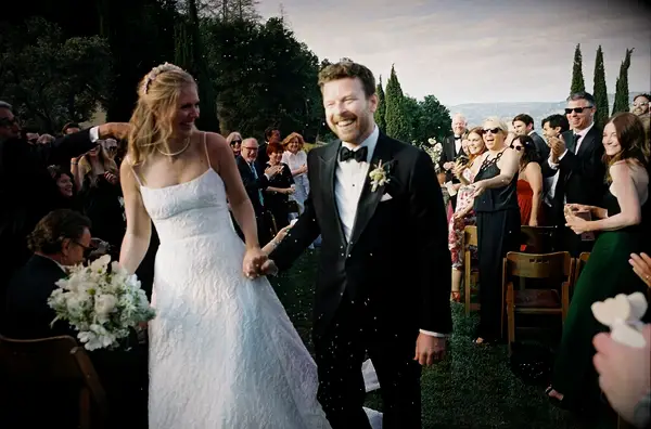 Bride and groom walking down aisle blurry wedding photo