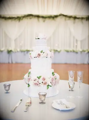 Pink tiered wedding cake with florals