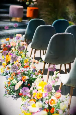 colorful flowers along wedding aisle