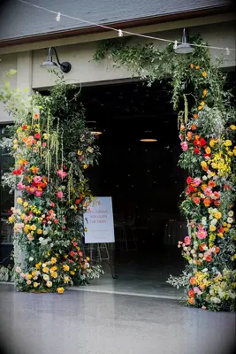 wedding entrance with floral arch