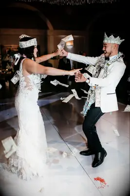 Bride and groom doing a money dance. 