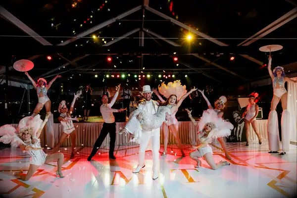 Bride and groom dancing with professional dancers. 