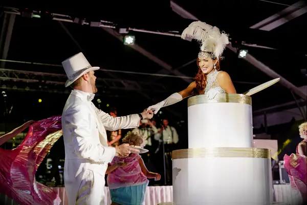 Bride jumping out a fake wedding cake. 