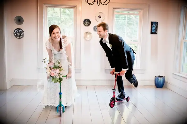 Bride and groom riding kids