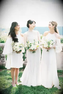 Bride with two bridesmaids in white dresses