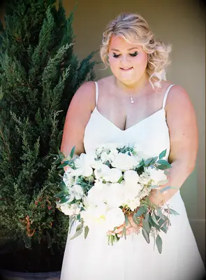 Bride holding textural white wedding bouquet