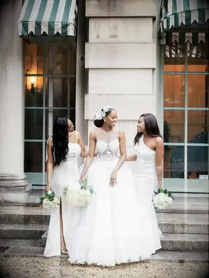 Bridesmaids in long white dresses