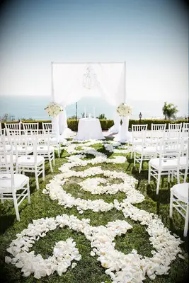 White rose aisle runner at fairytale-themed wedding