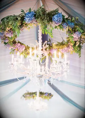 Floral chandelier at fairytale-themed wedding