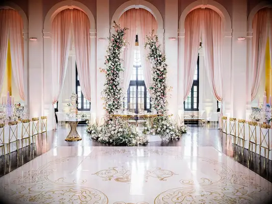 Pink monogrammed dance floor at fairytale wedding