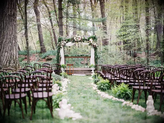 Fairytale-themed decor at outdoor wedding ceremony