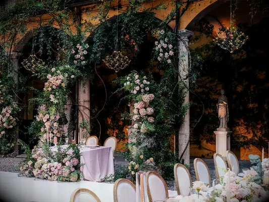 Sweetheart table backdrop at fairytale-themed wedding
