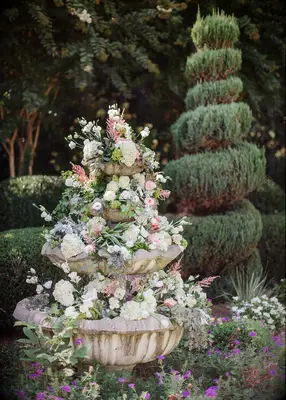 Floral wedding fountain at fairytale-themed wedding