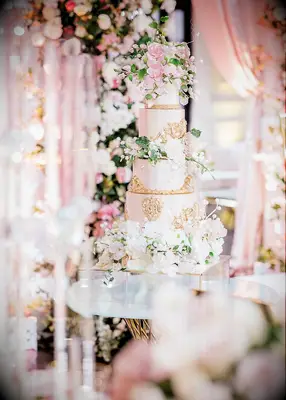 Pink and gold fairytale-themed wedding cake