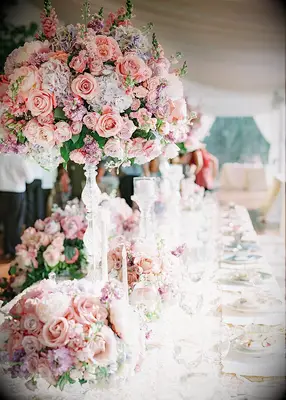 Pink floral centerpiece at fairytale-themed wedding