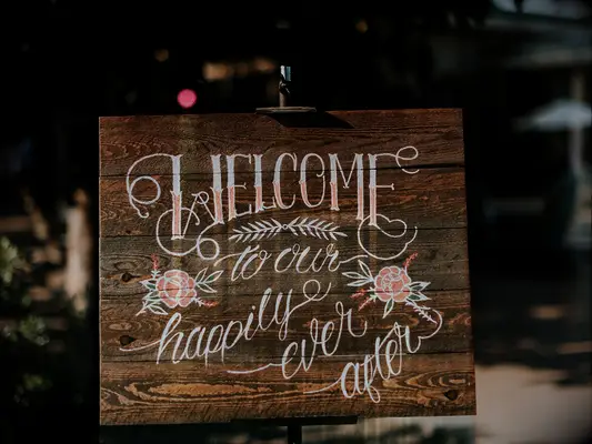Wooden fairytale-themed wedding sign