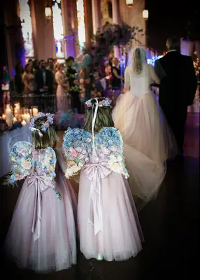 Flower girls wearing floral fairy wings