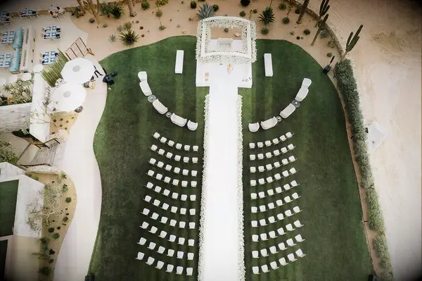 A modern, all-white wedding ceremony site.