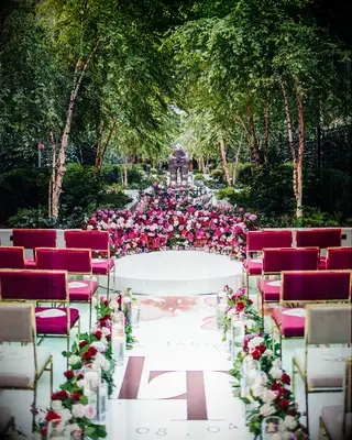 A vibrant wedding aisle in all shades magenta and fuchsia.