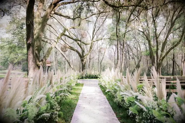 Dreamy waving fronds of pampas grass set the tone for this boho wedding.