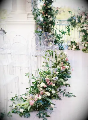 These pastel arrangements are perfect to guide guests up a dreamy wedding aisle.