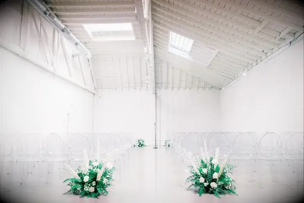 A beautiful wedding ceremony site complete with see-through chairs.