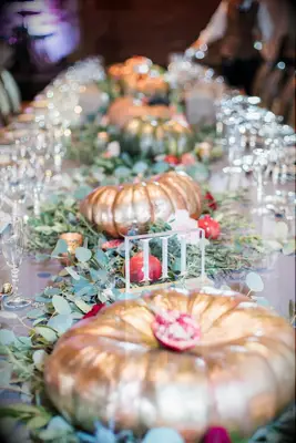 Gilded Pumpkin and Eucalyptus Centerpieces and Roman Numeral Table Number
