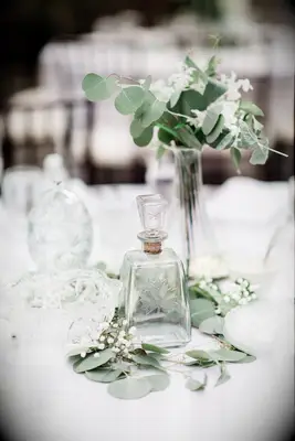 Elegant Centerpiece with Eucalyptus and Glassware