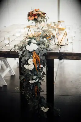 Farm Table with Eucalyptus Garland and Terrariums