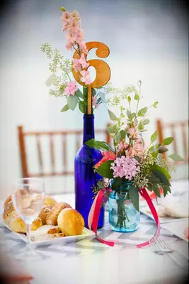 Eucalyptus and Stock-Filled Blue Glass Bottles and Jars