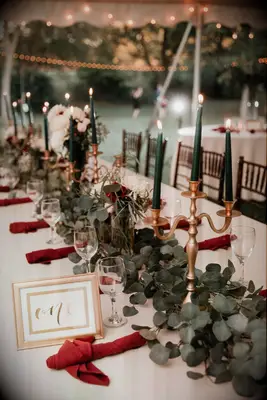 Eucalyptus and Candelabras Decorate Dining Tables at Wedding Receptions