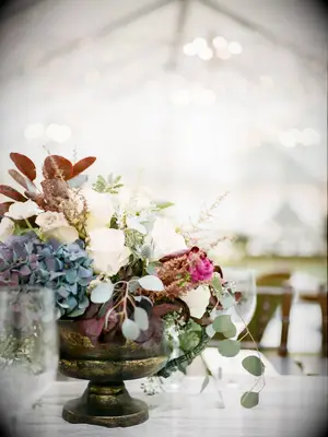 Flowers and Eucalyptus Filled Thrifted Vases and Served as Wedding Centerpieces