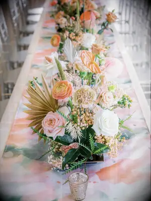 Peach-Hued Centerpiece With Dried Palm Fronds