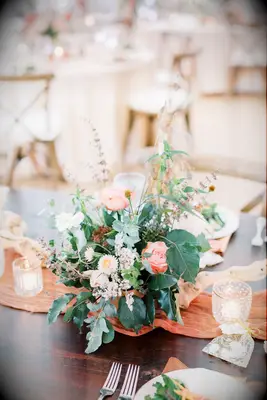 Floral centerpiece with lush greenery