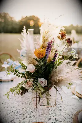 Arrangement with pincushion protea and pampas grass
