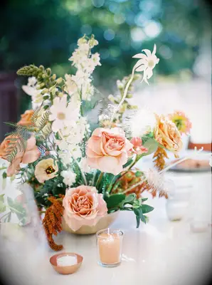 Boho floral arrangement with roses and wildflowers 