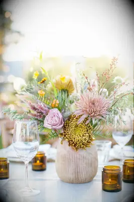 Chrysanthemum floral arrangement in clay vessel