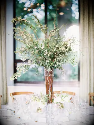 Tall white wildflower rustic wedding centerpiece