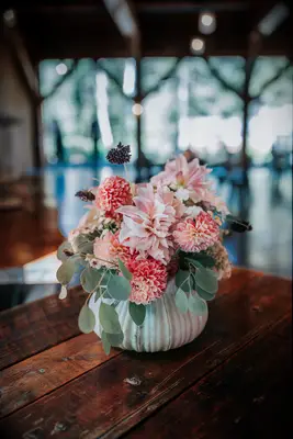 Dahlia centerpiece in clay container 