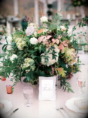 Large centerpiece filled with lush greenery